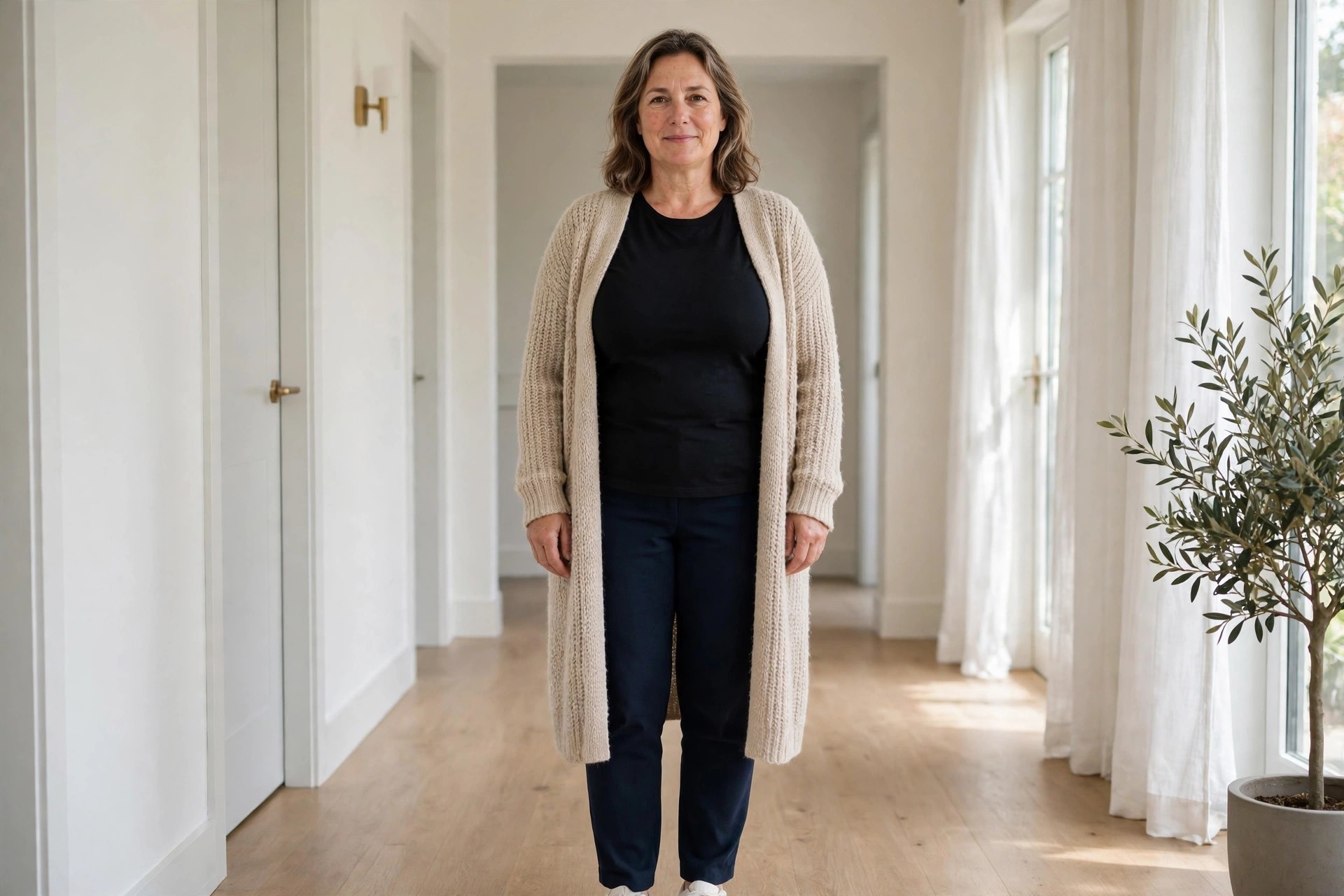Top heavy woman wearing a long open cardigan styled in outfit thirds