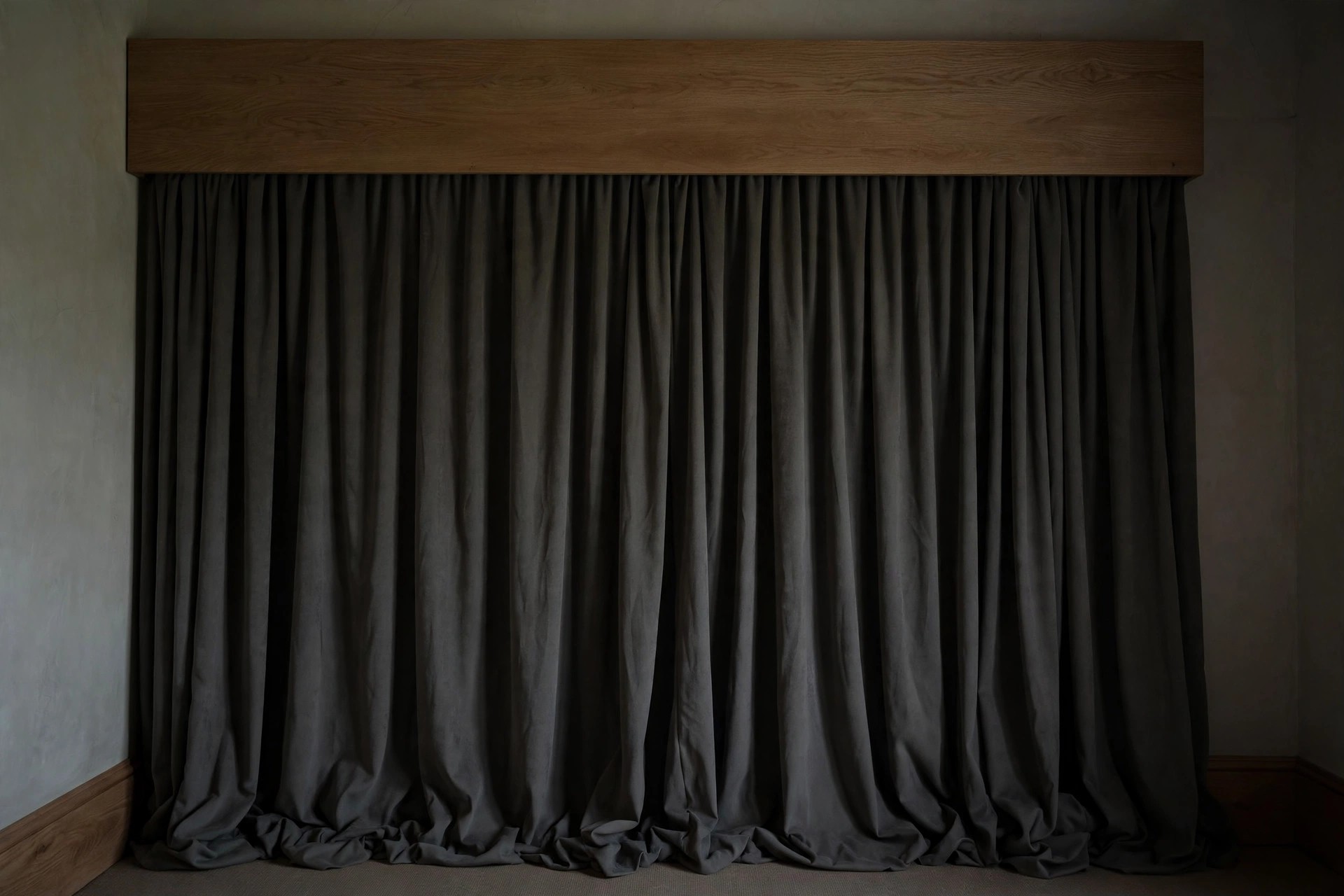 Curtain edges sealed against the wall with a covered pelmet blocking light above