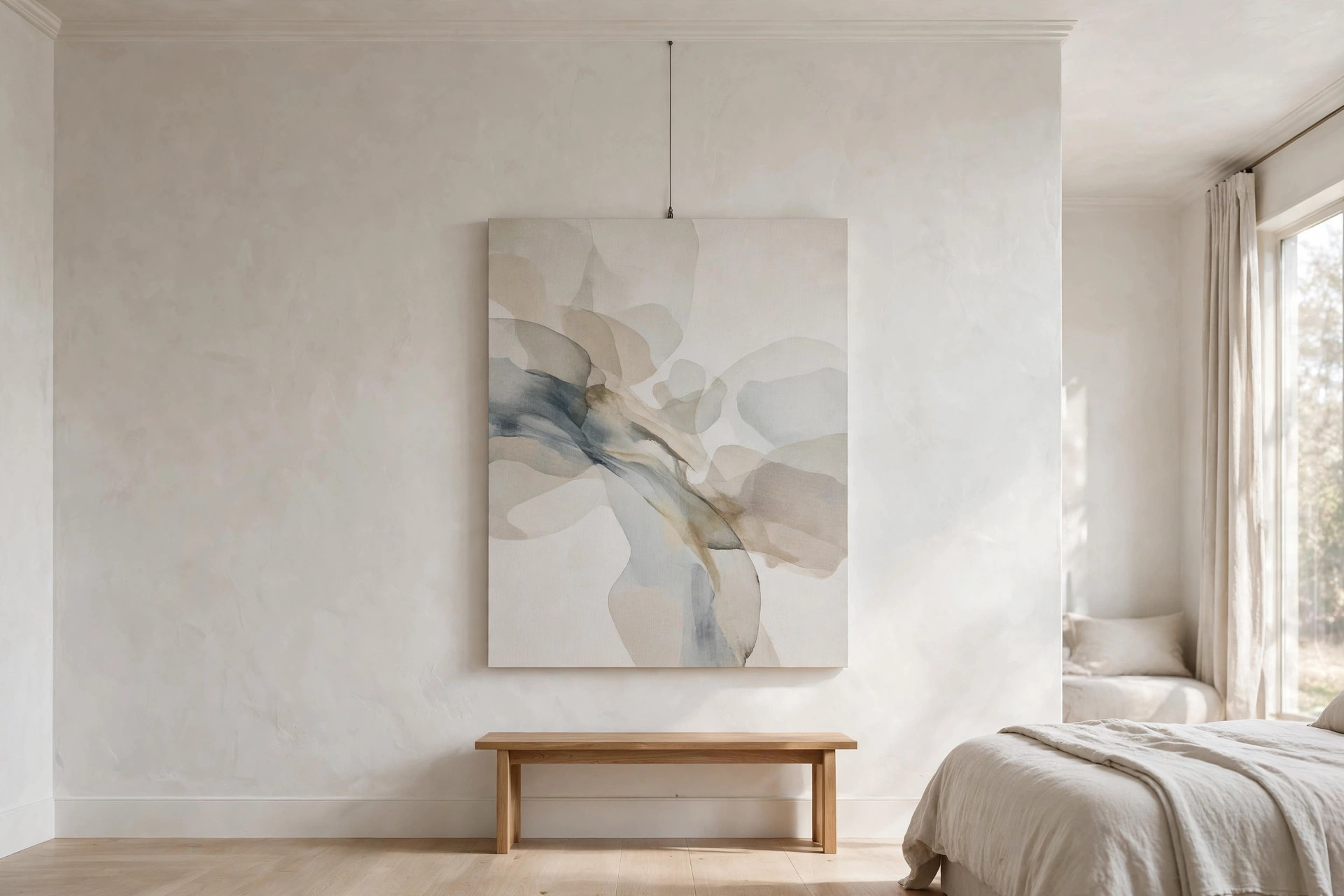 One large soft abstract canvas alone on a tall white wall above a simple wooden bench
